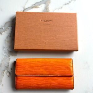 Louis Vuitton Epi leather orange wallet in used condition. No cracks or odors